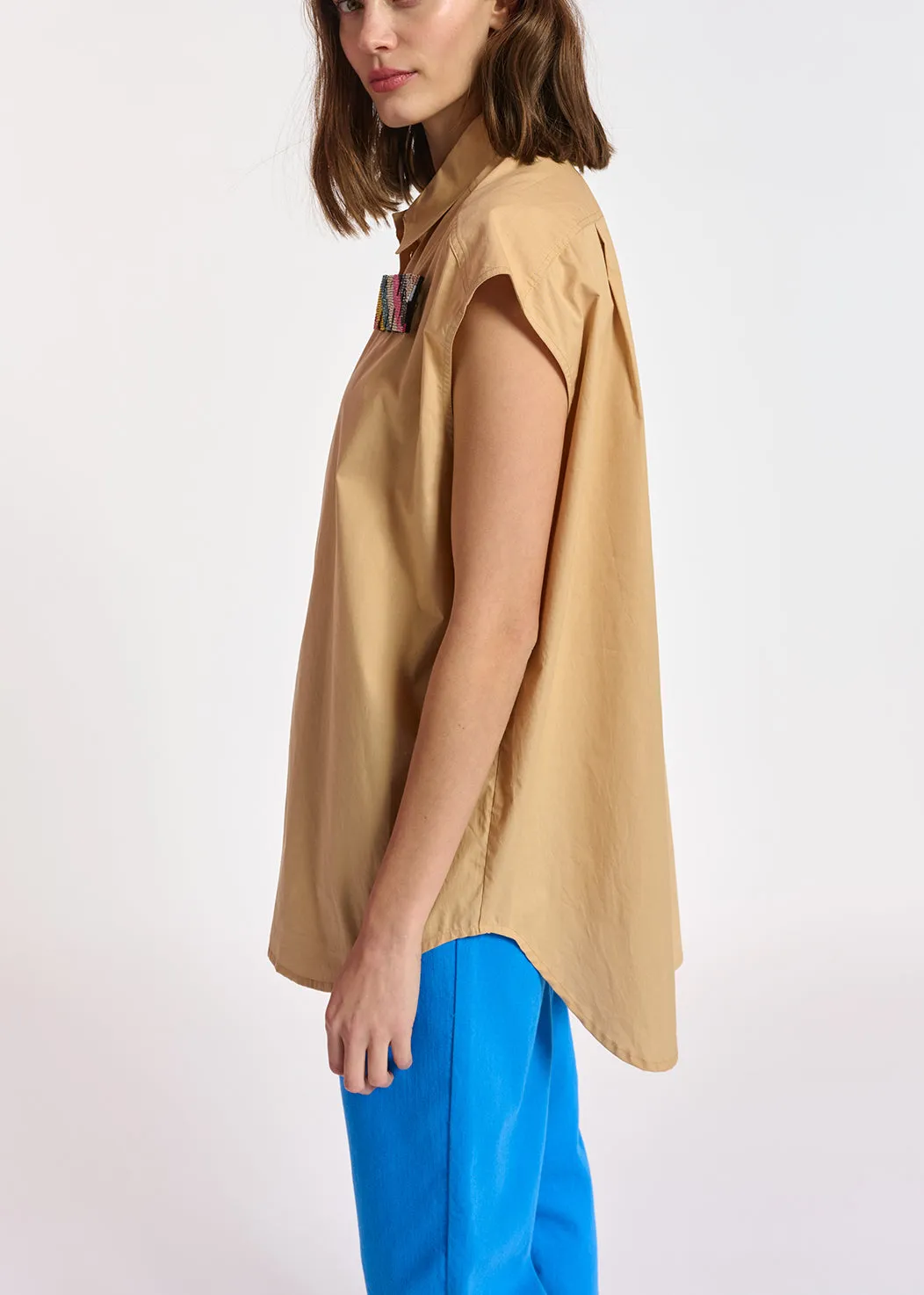 Beige sleeveless cotton shirt