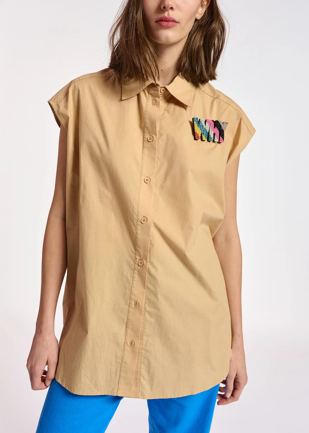 Beige sleeveless cotton shirt