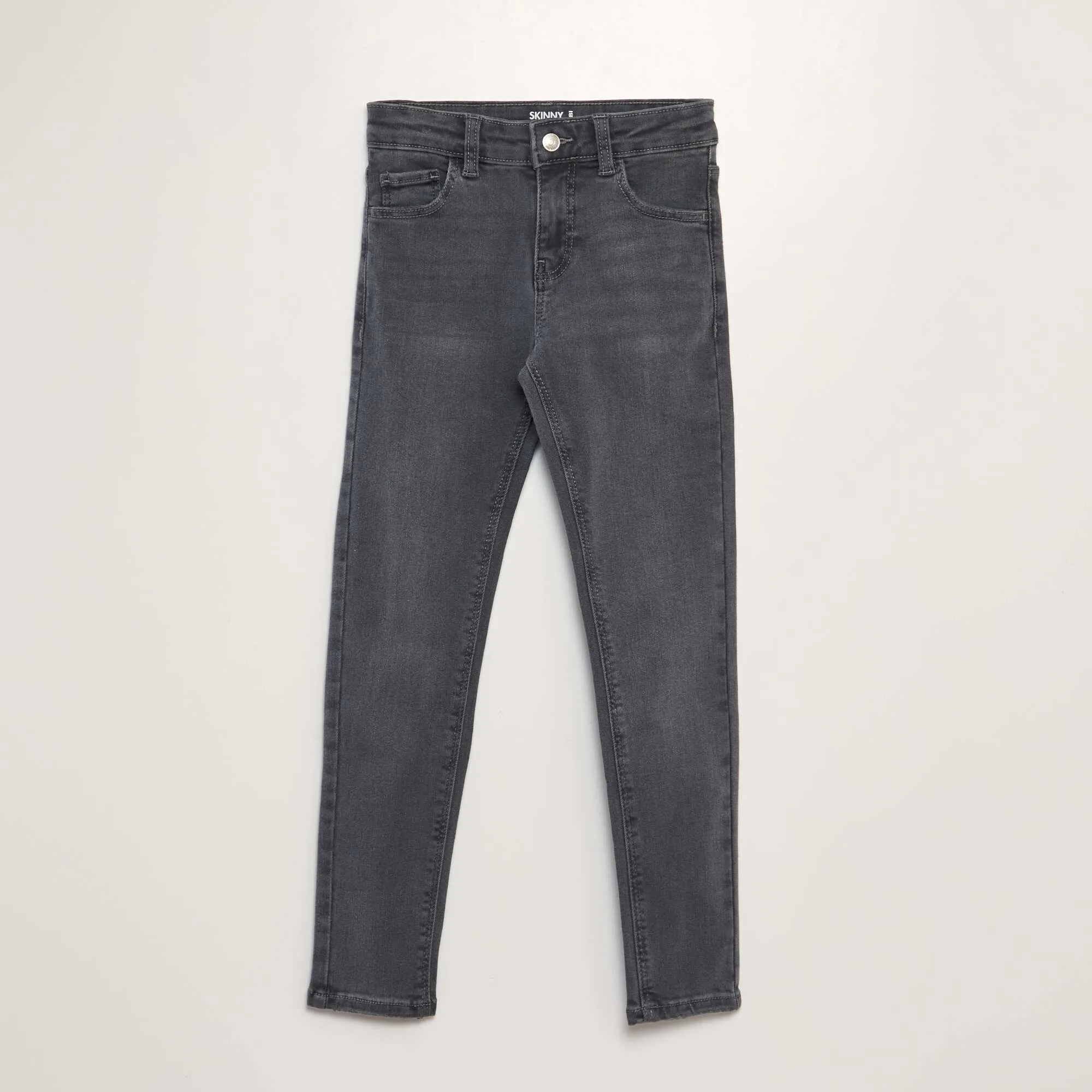 Skinny denim trousers. GREY
