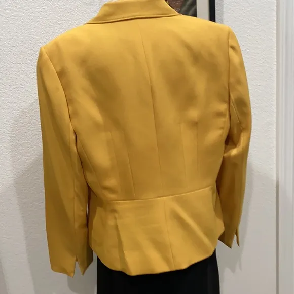 Take charge in this two piece business suit with scarf.