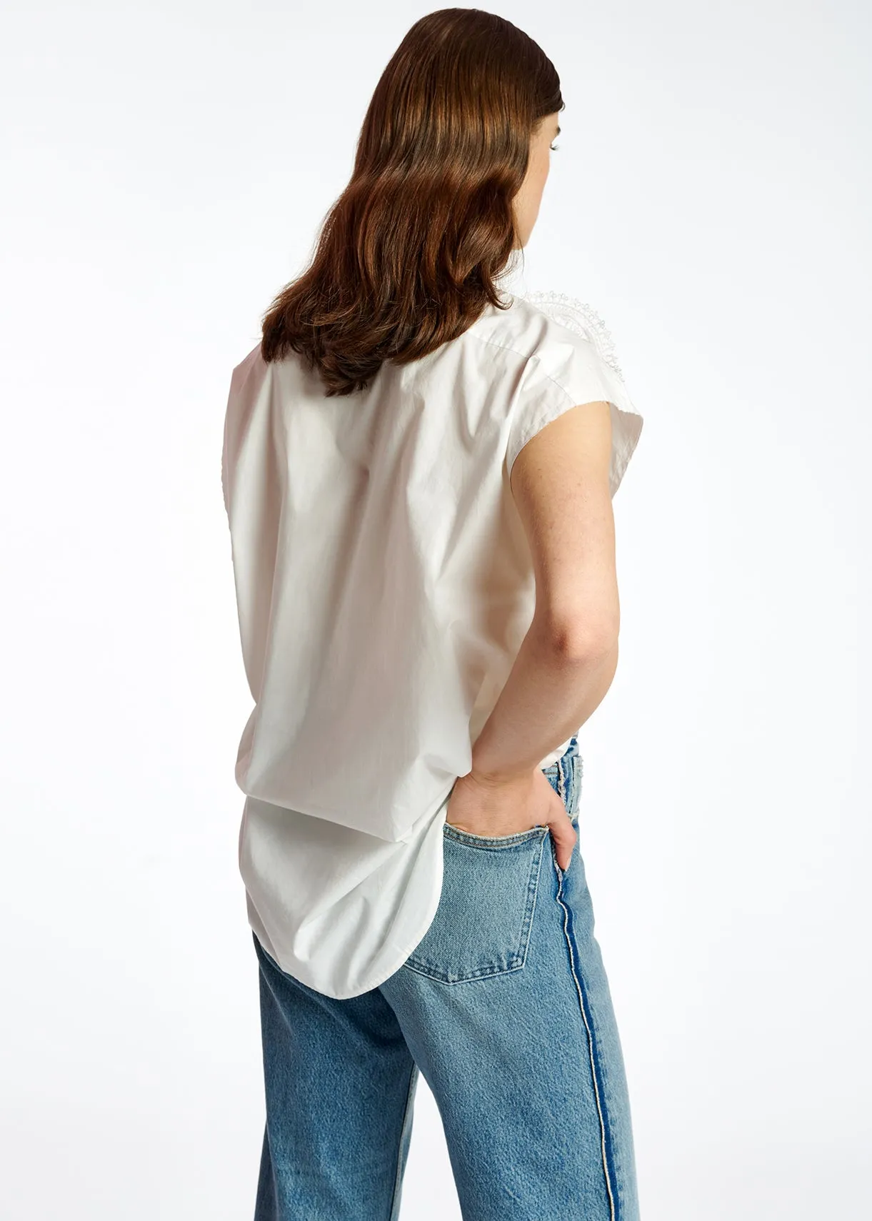 White cotton sleeveless shirt with lace embroidered trimmings